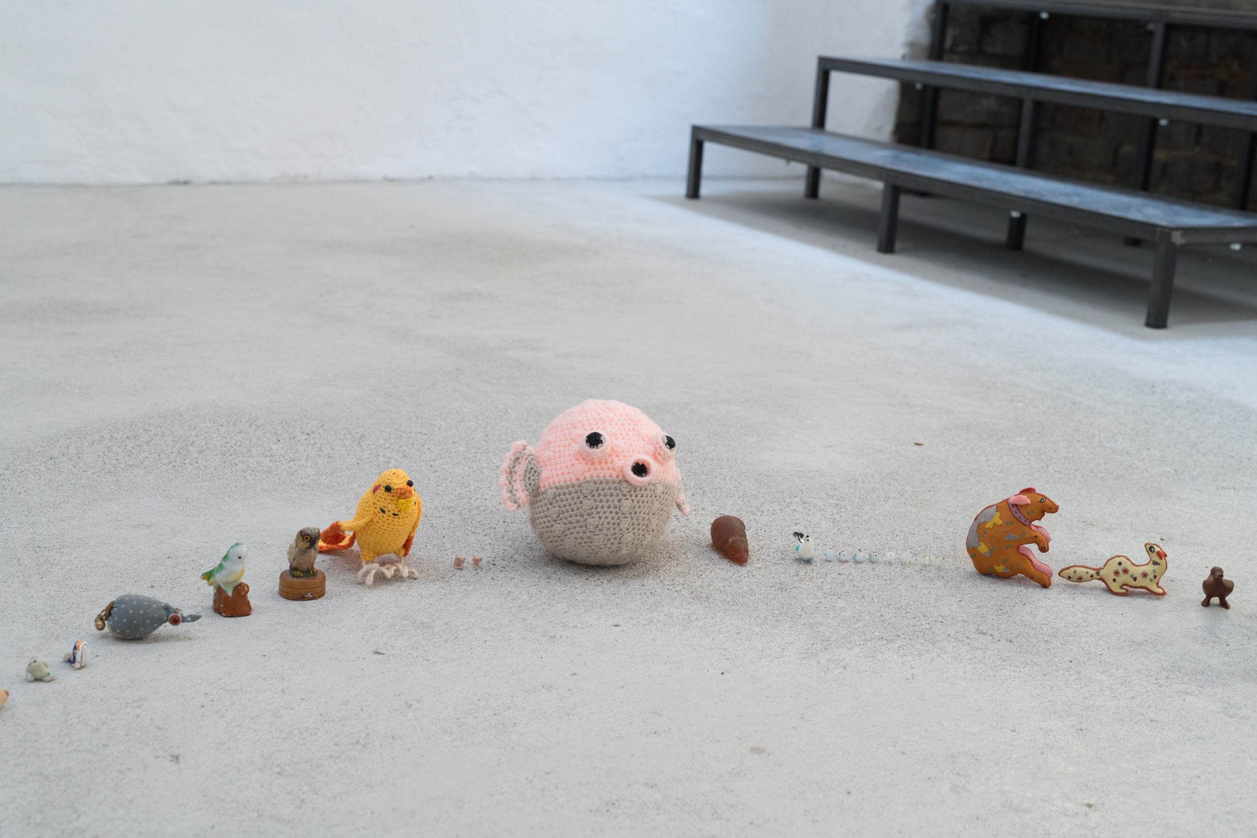 Emily Jones, The Lookers, Porcelain, glass, wicker, plastic, rubber, cotton & wooden animal figures, lollipop (detail)