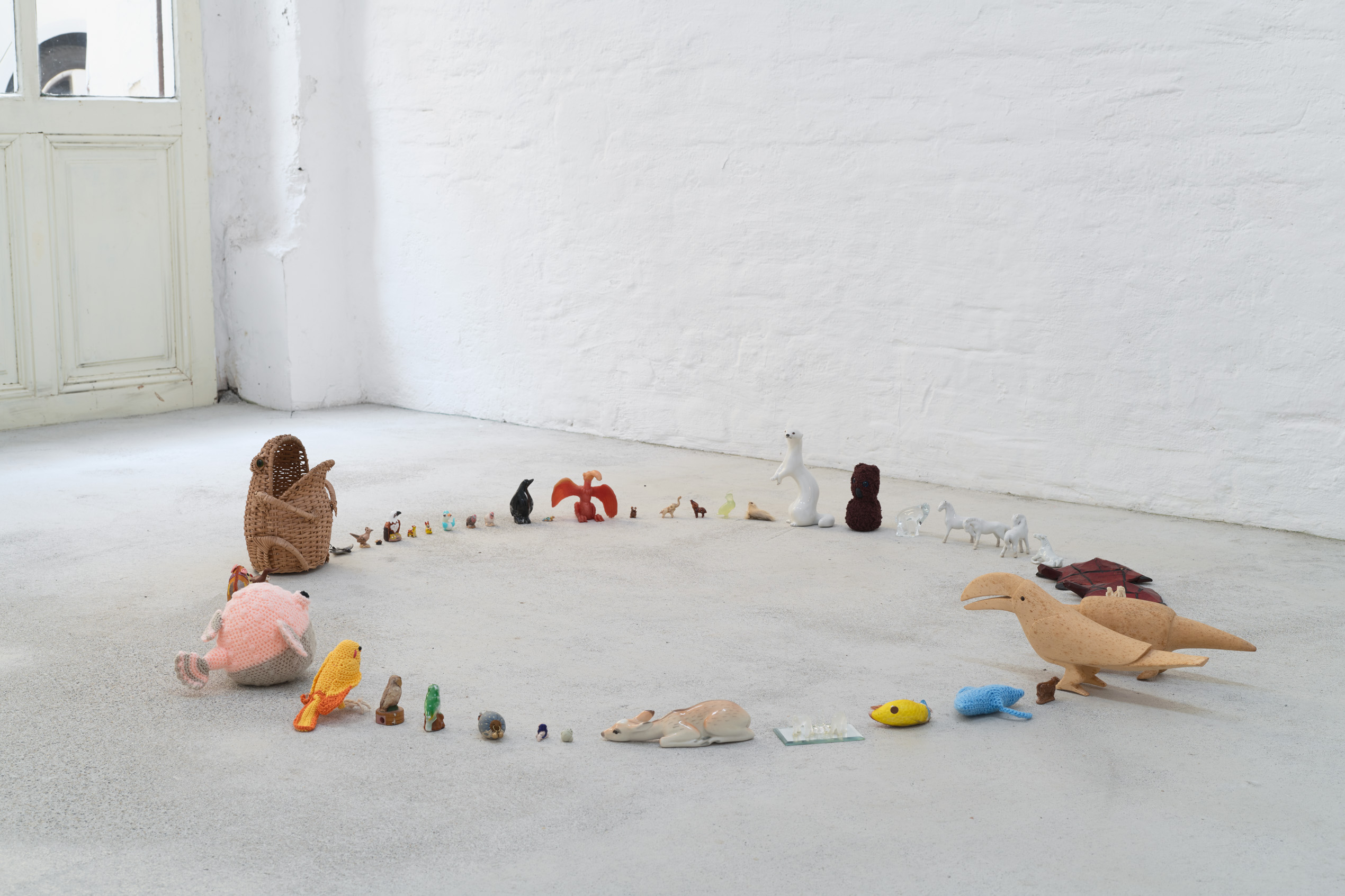 Emily Jones, The Lookers, Porcelain, glass, wicker, plastic, rubber, cotton & wooden animal figures, lollipop
